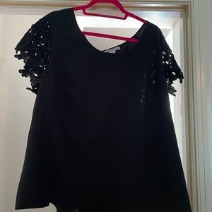Brand new with tags.  Modamix 2x silk blouse with gold zipper up the black